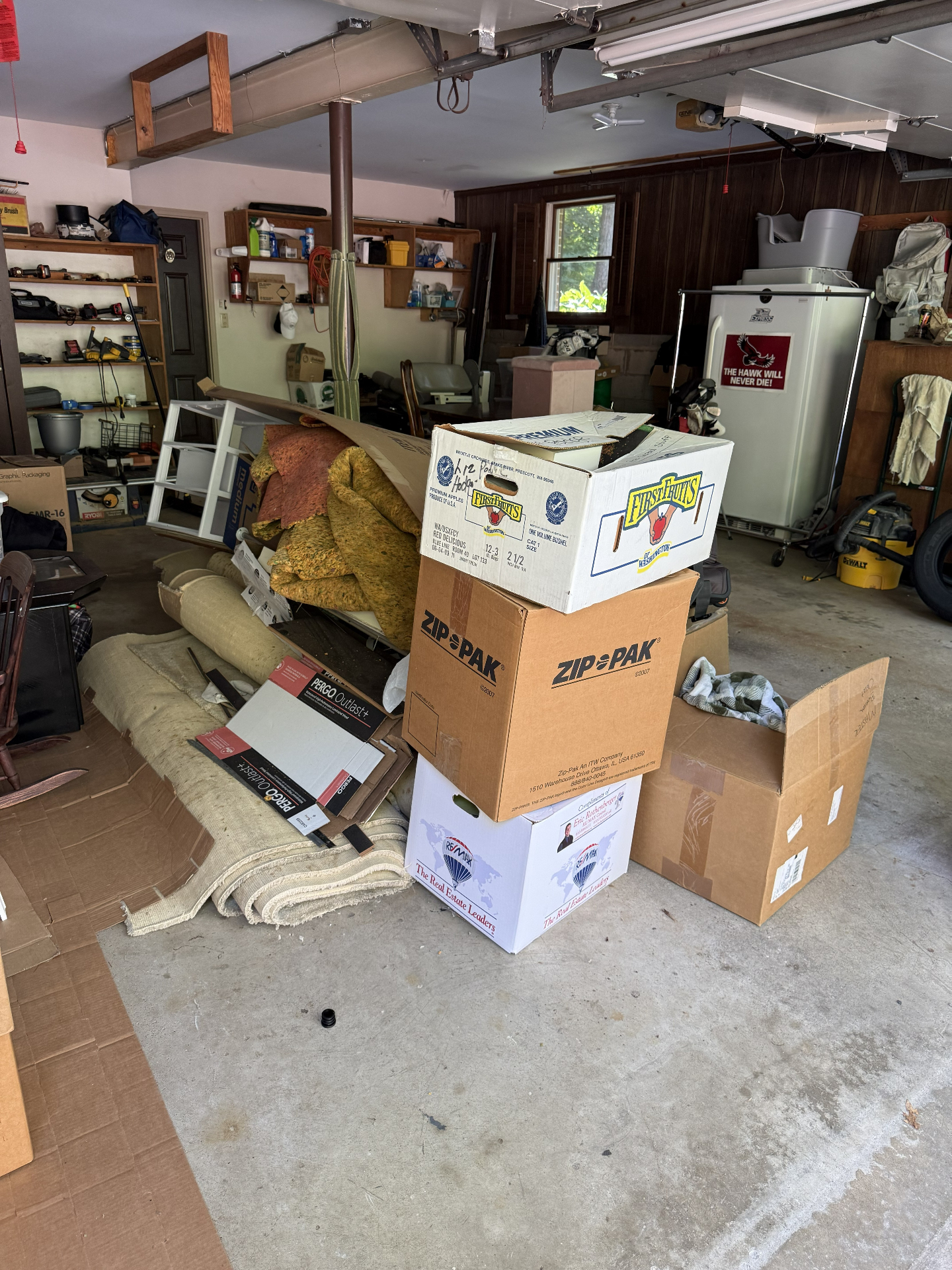 Cluttered garage before a T1 Junk Removal cleanout